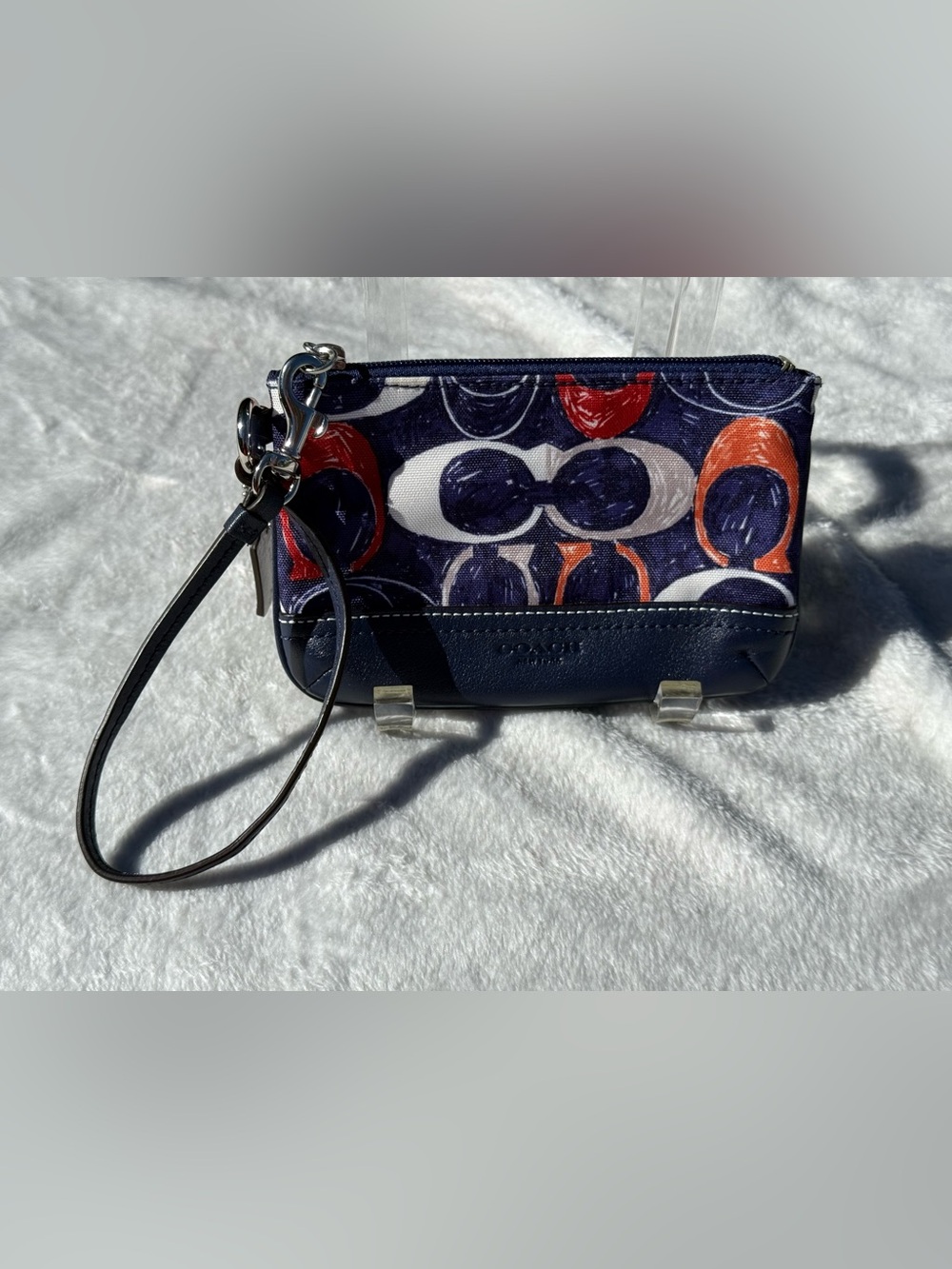 Coach Legacy Heritage Signature C scribble print wristlet.